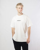 Man wearing a white 100% cotton t-shirt (front)